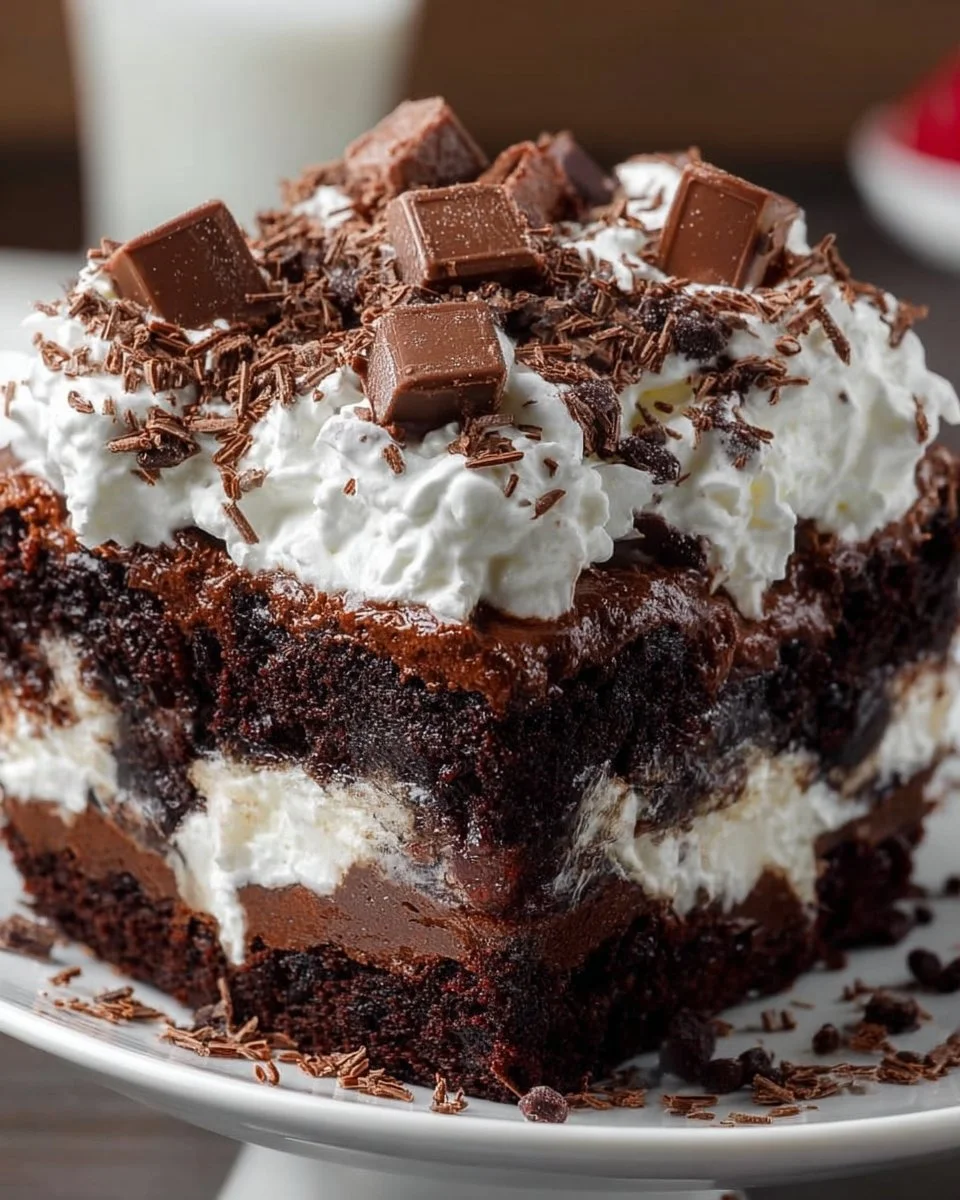 Delicious brownie trifle with layers of chocolate, cream, and brownies.